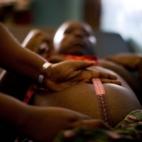Pregnant woman in Tanzania being measured by a midwife. (Photo courtesy of Jhpiego.) Pregnant woman in Tanzania being measured by a midwife. (Photo courtesy of Jhpiego.)